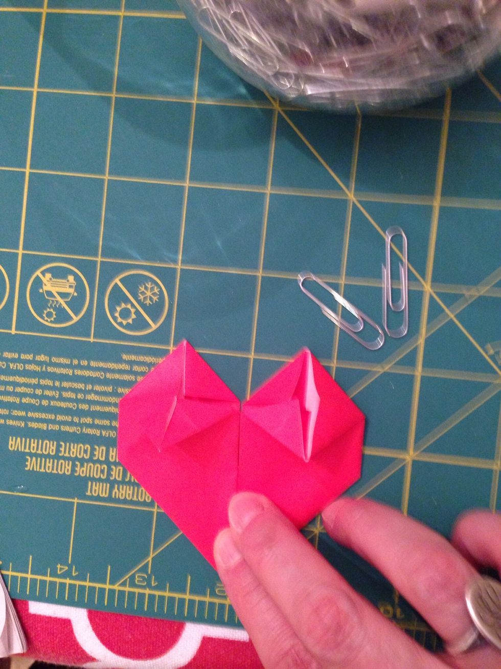 Fold the top and bottom points to the center crease.