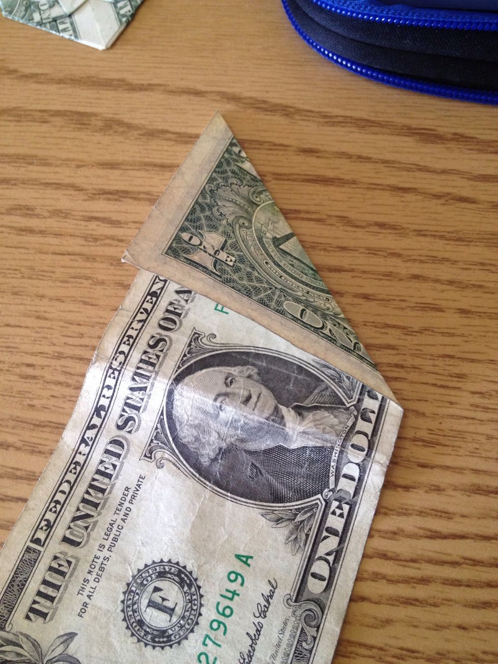 Fold the top corner down like this.