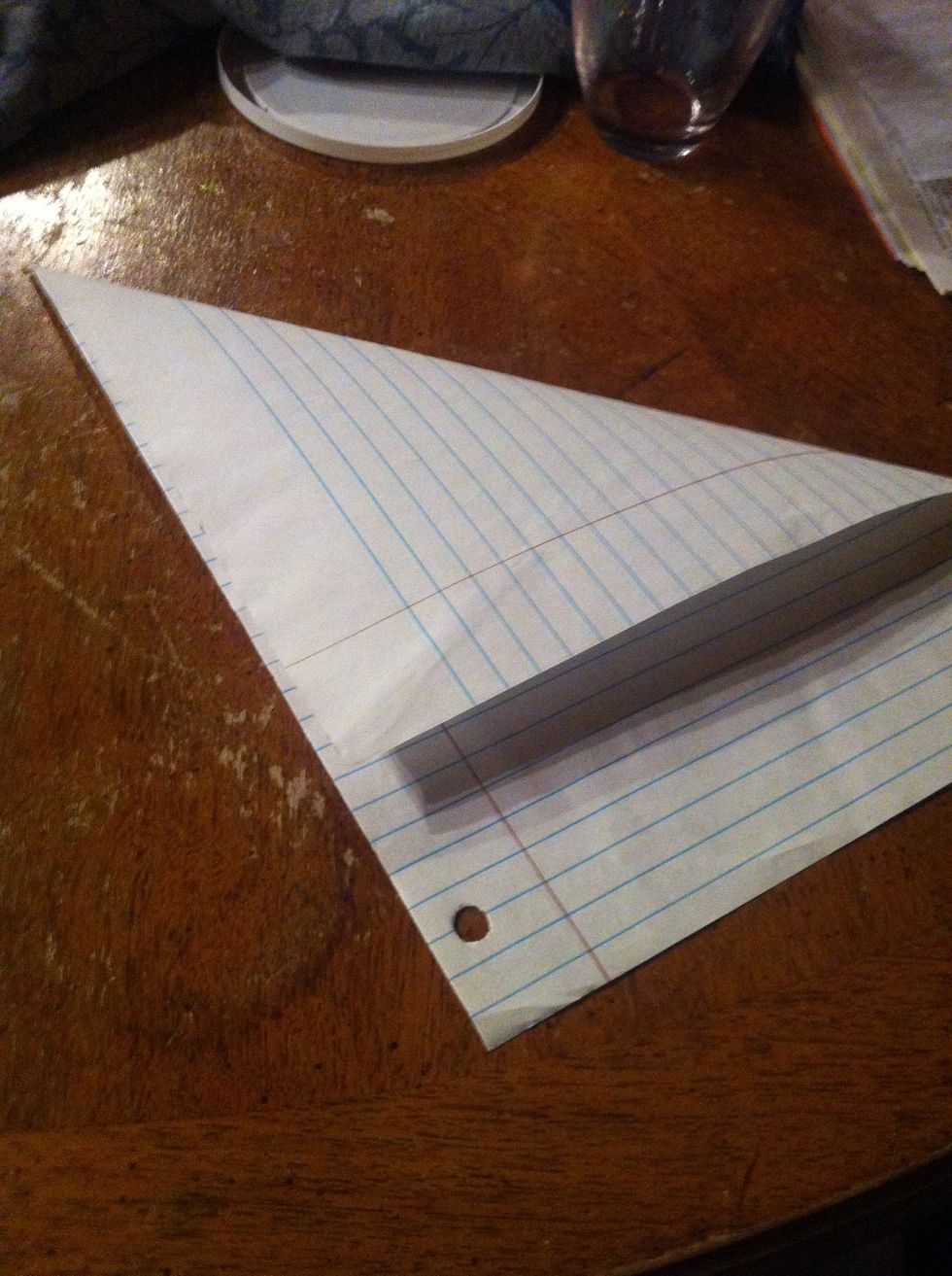 Fold the top corner down more than half way
