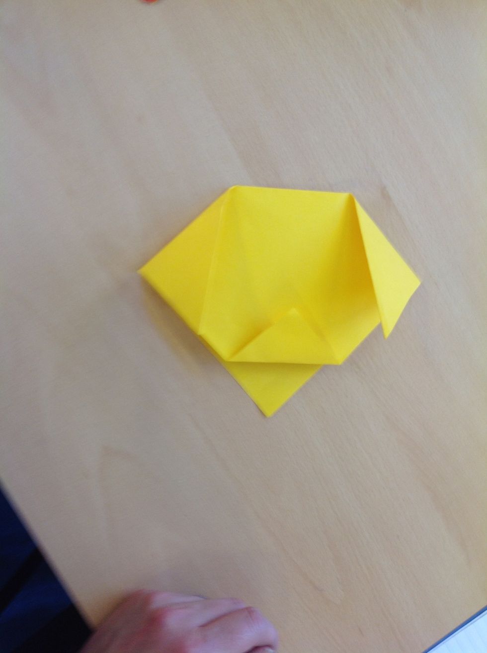 Fold the top corner of the mouth up.