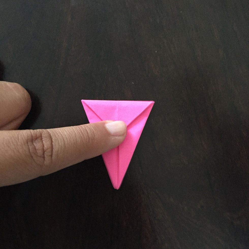 Fold the top down towards the middle to create a crease.