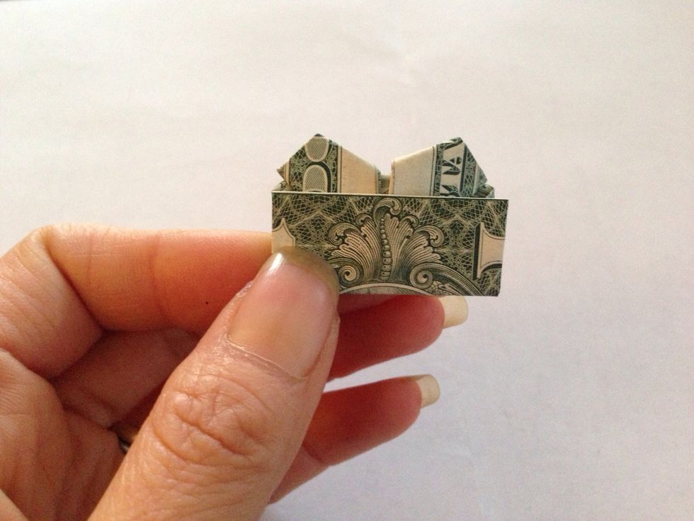 Fold the top extra border down inward to reveal the top of heart.