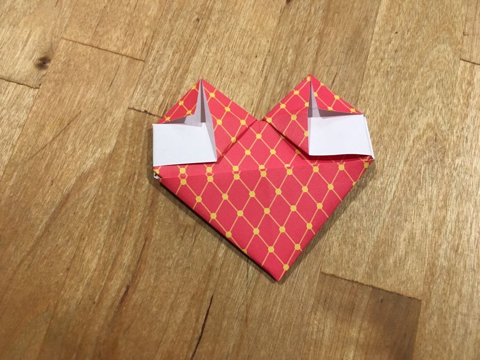 Fold the top flap to make it a triangle.