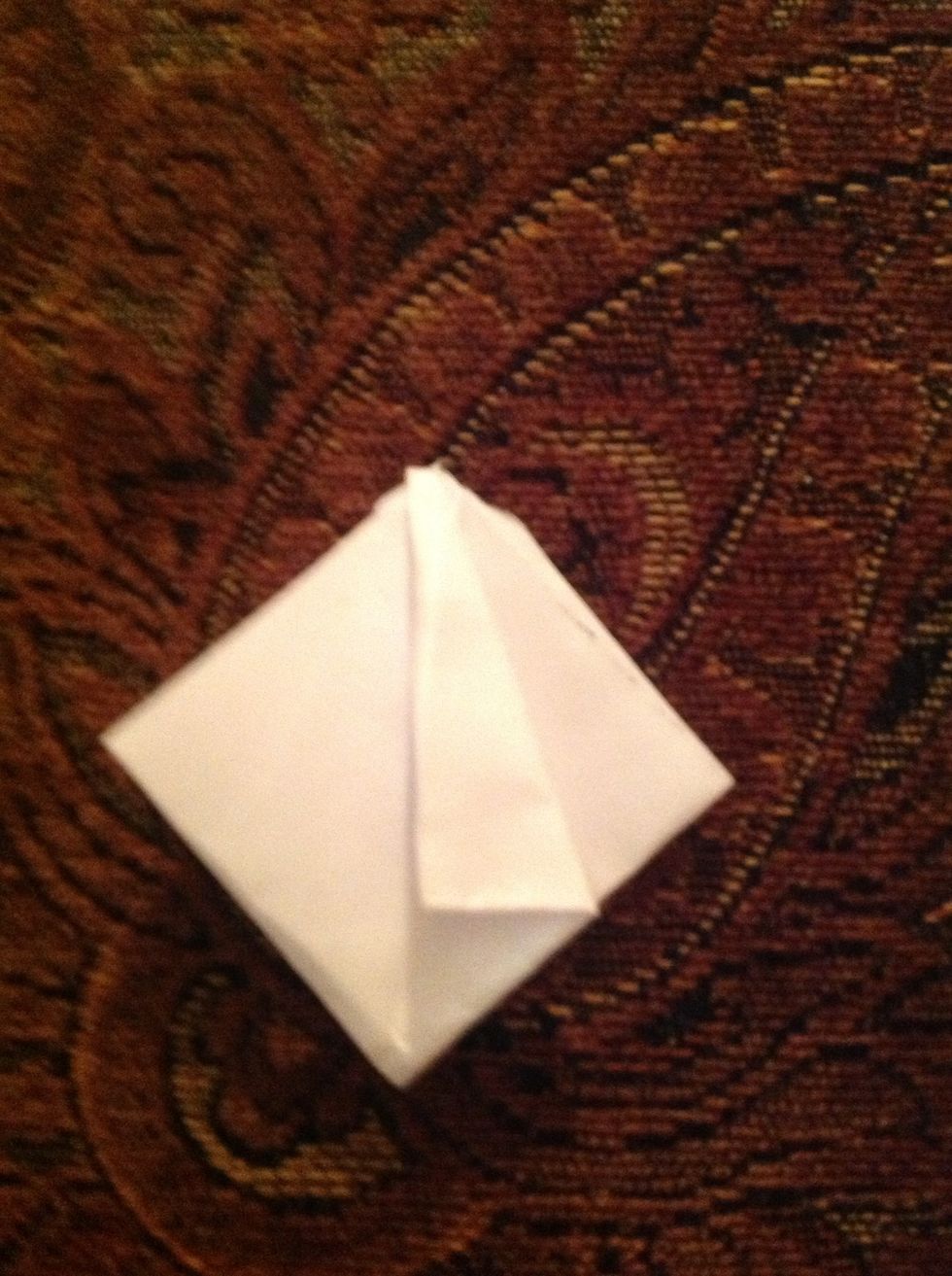 Fold the top flap where the paper is open.