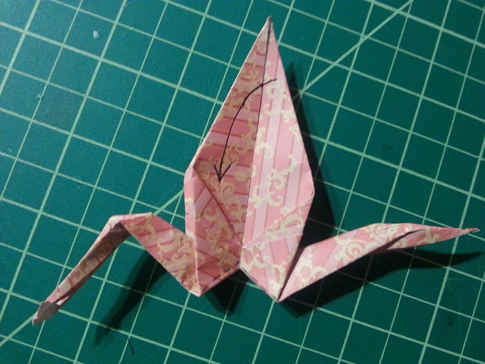 Fold the top flat down until it cannot be folded down anymore.