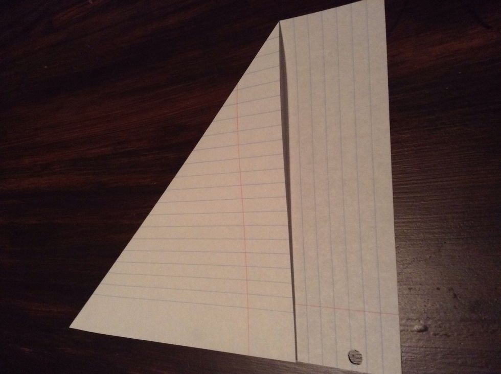 Fold the top left corner down along the side.