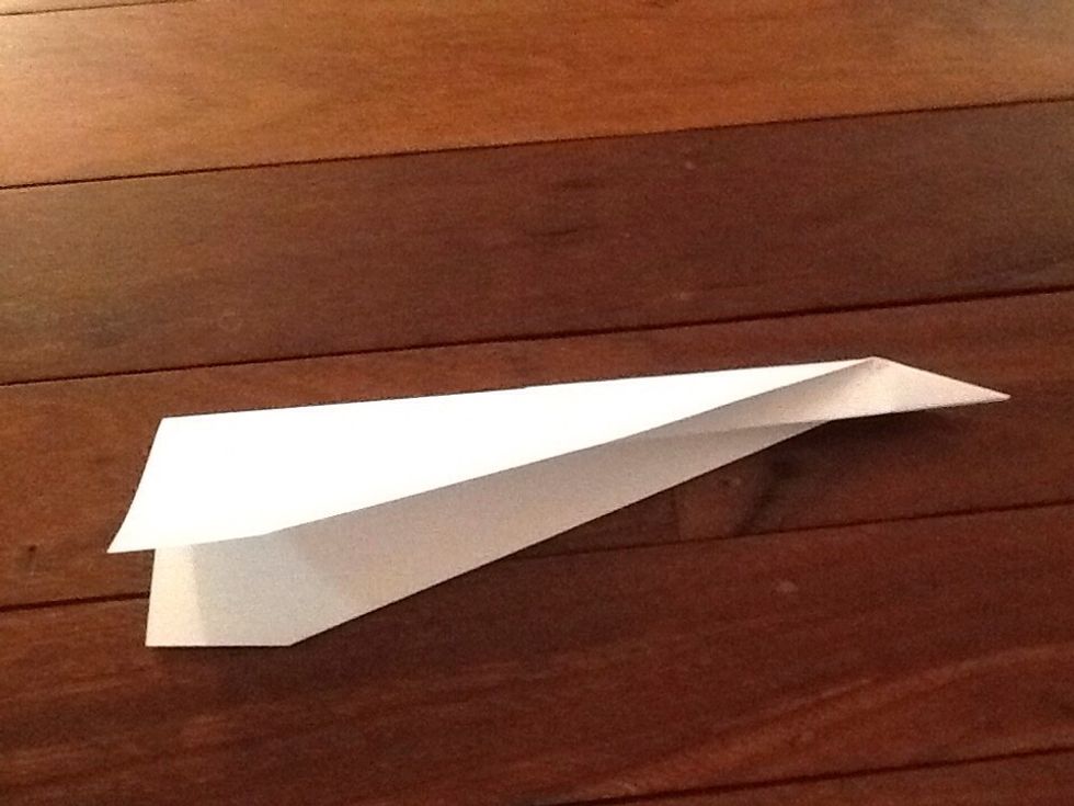 Fold the top part down a little but not to much other wise it will not have a section under the plane.