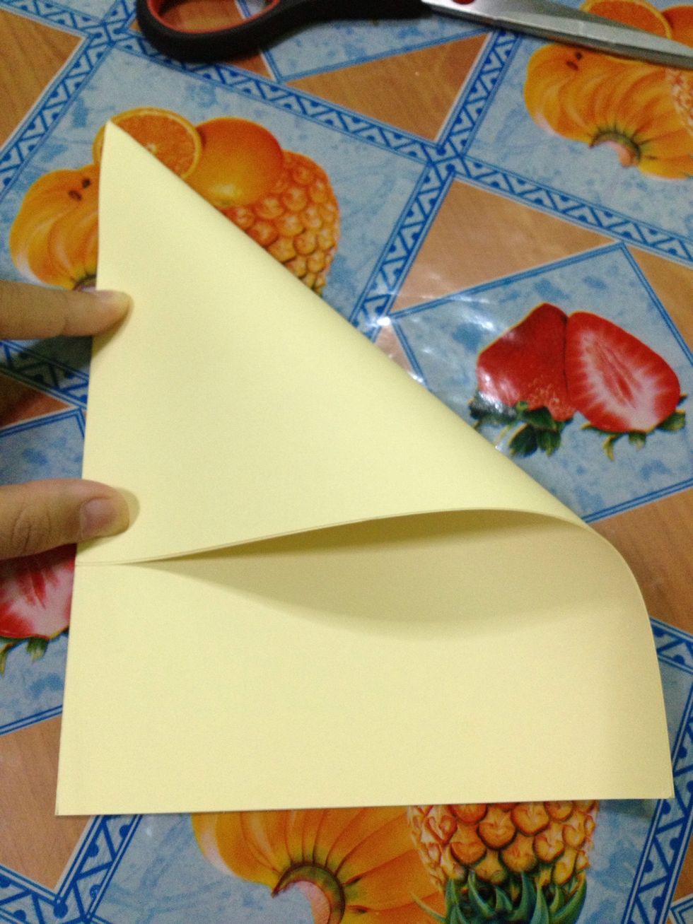 Fold the top right corner to the left side (as shown on the picture).