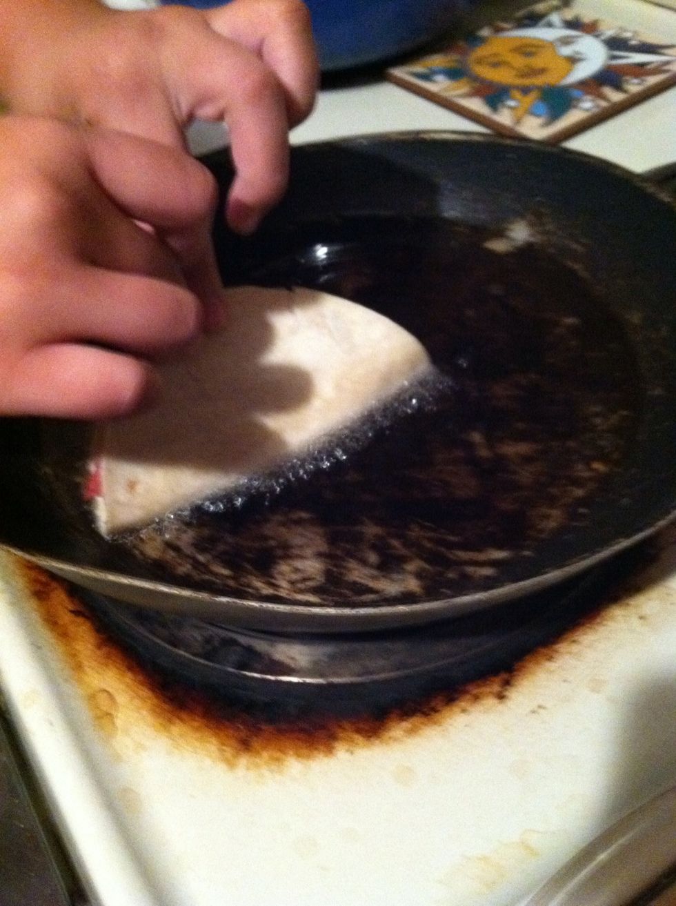 Fold the tortilla and lay it with the meat side down.