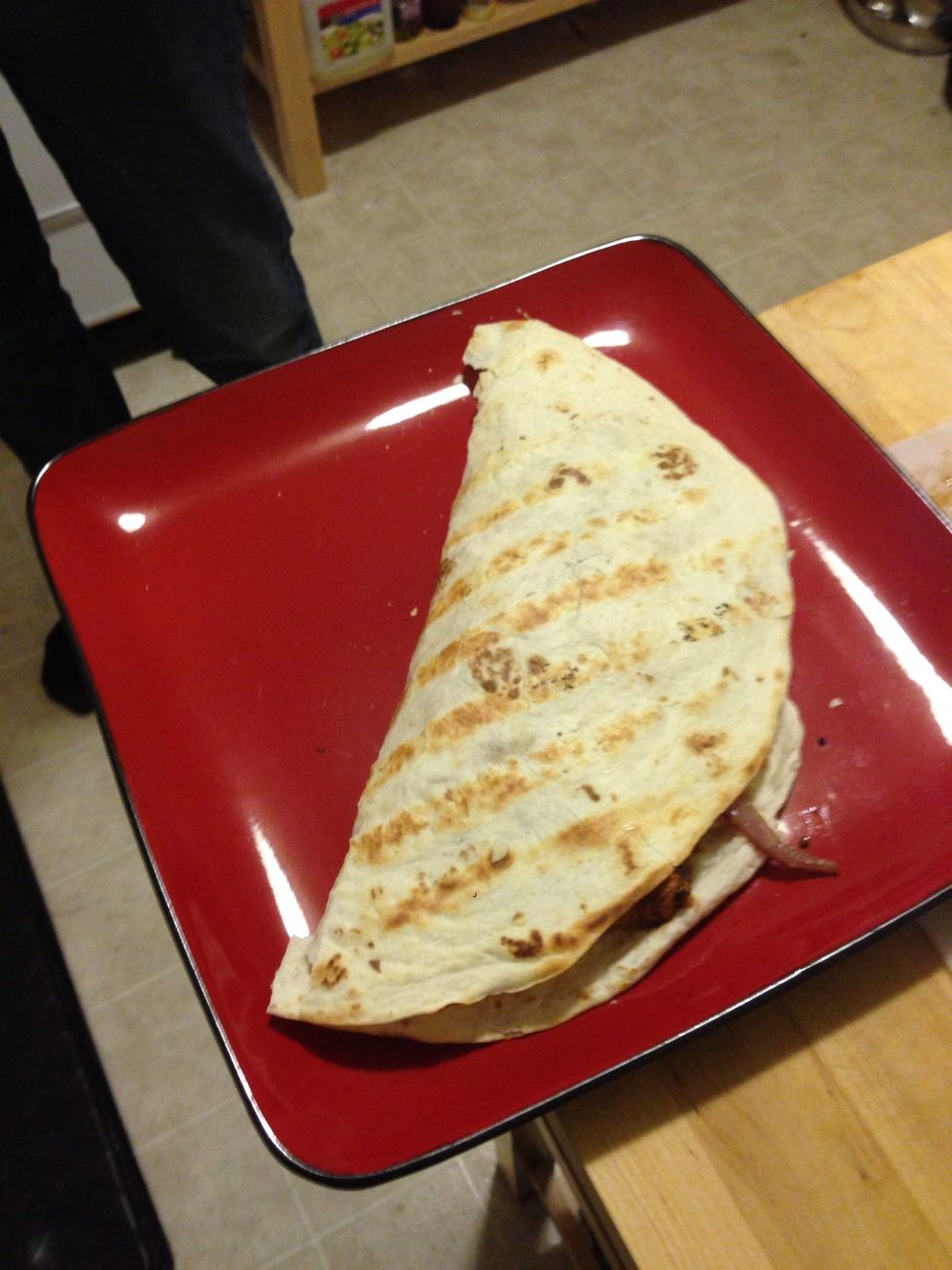 Fold the tortilla in half.