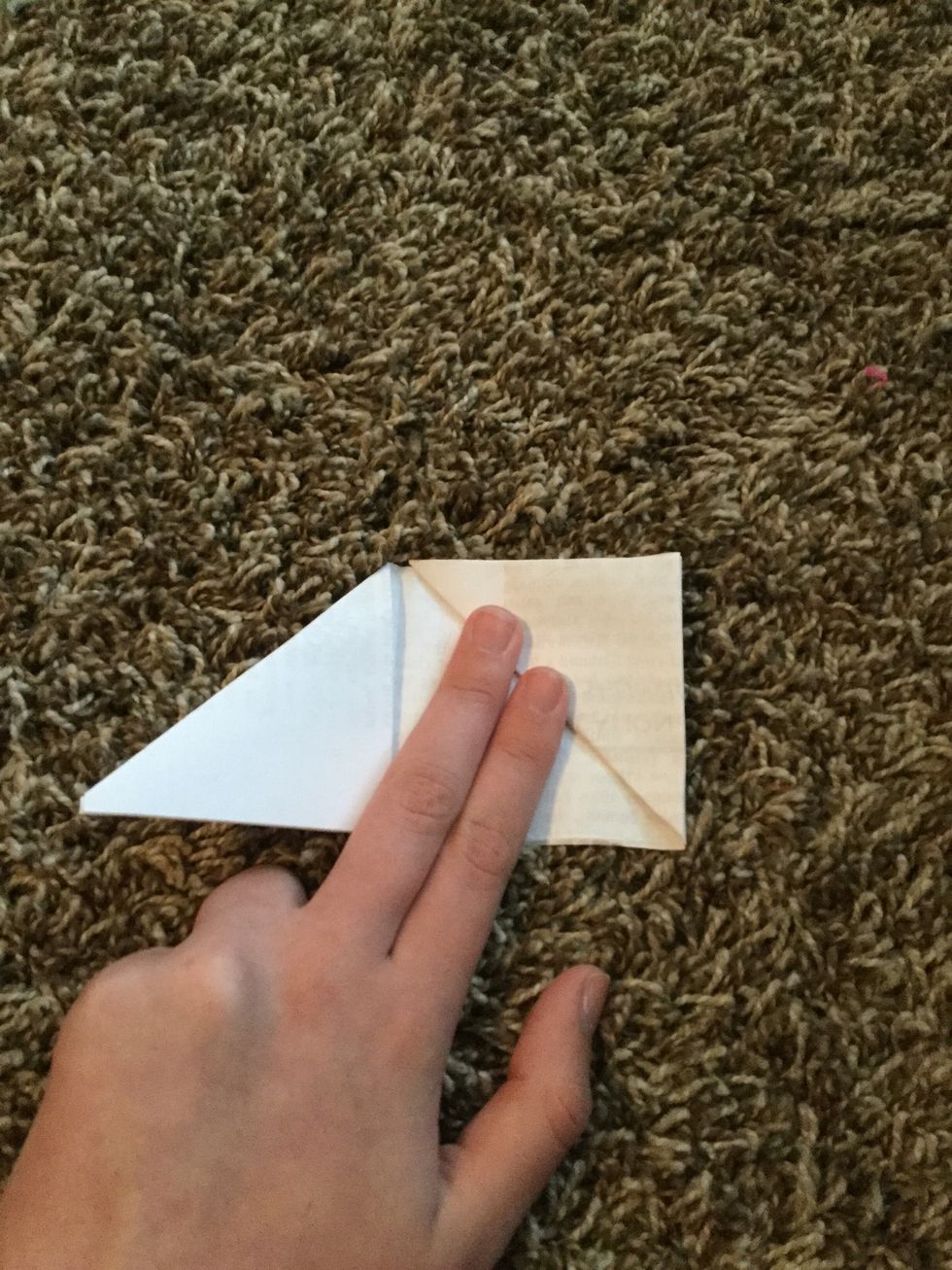 Fold the triangle into the middle.