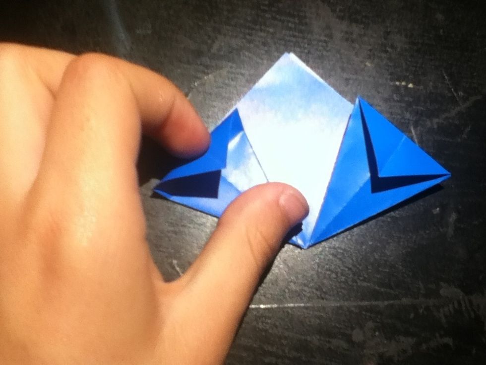 Fold the triangular tops of your flattened parts down.