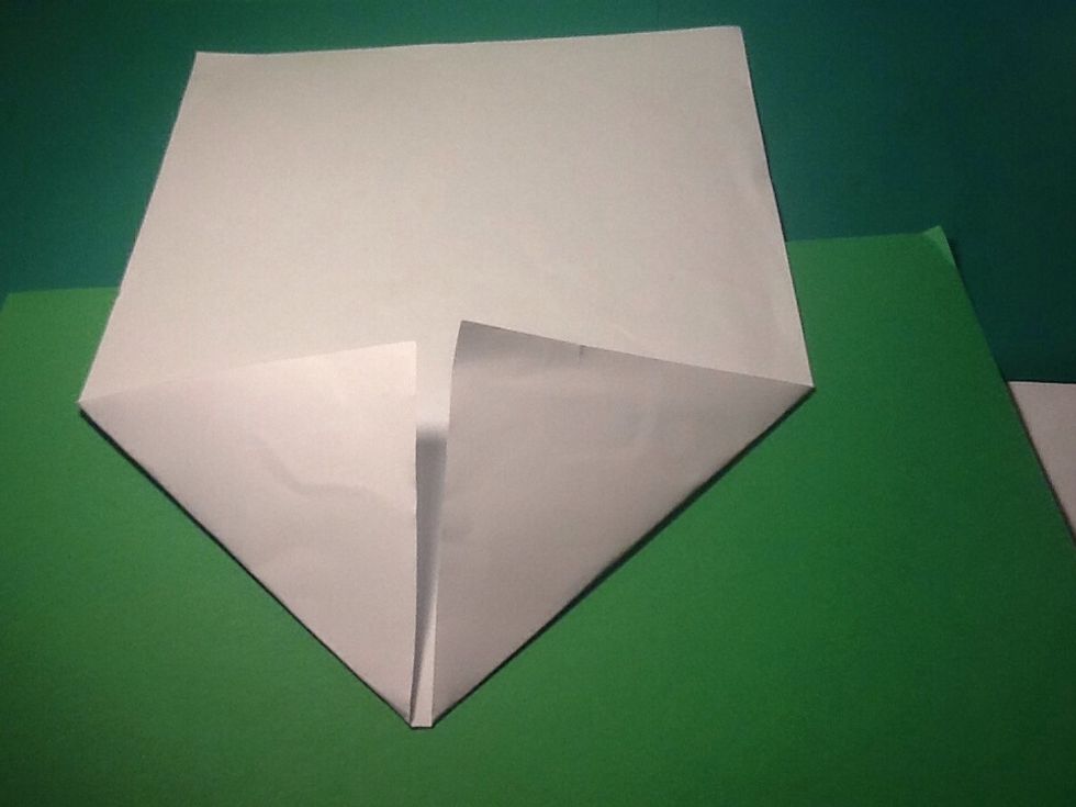 Fold the two corners until they meet