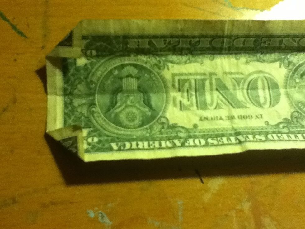 Fold the two corners up on the opposite end to the collar...