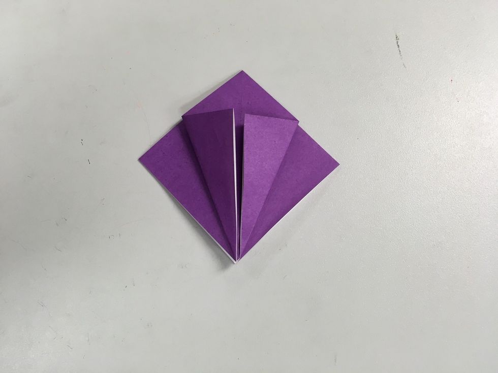 Fold the two flaps in to the center line.