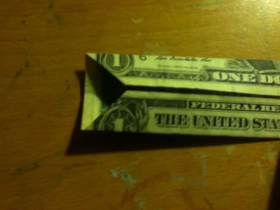 Fold the two sides back in, keeping the corners folded...