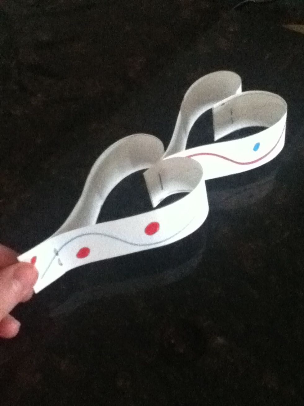 Fold the two strips over the staple and staple the bottom together. Now you have two hearts