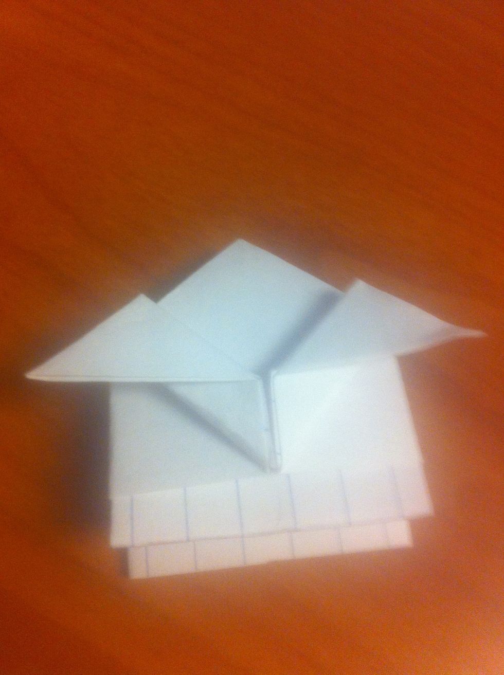 Fold the two tips of the triangle down to form smaller triangles. These will be your ears. You can experiment with different ears based on what you like.