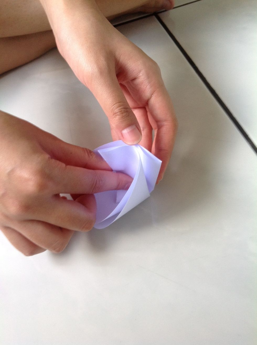 Fold the unfolded side into the inner side of step 5 folding to make an equilateral triangle shown in step 7