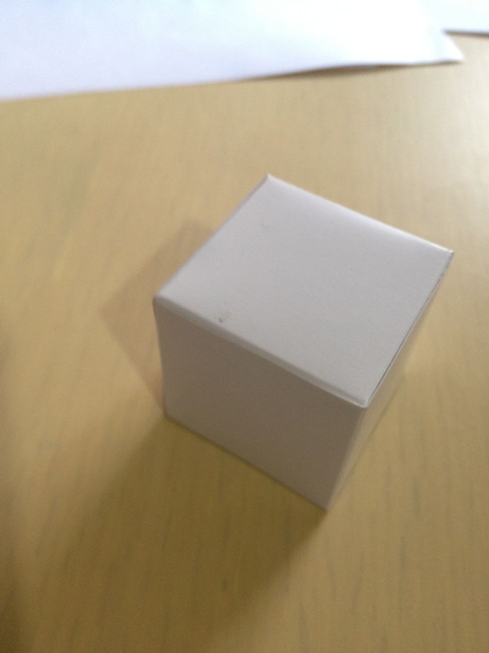 Fold the visual art playing block paper into a cube. Repeat step 1 and 2 to build 13 cubes..