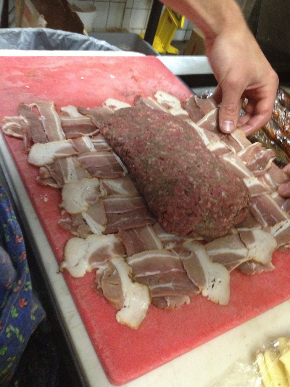 Fold the weave over your burger and try to get all the bacon ends tucked under each other so they are not hanging out