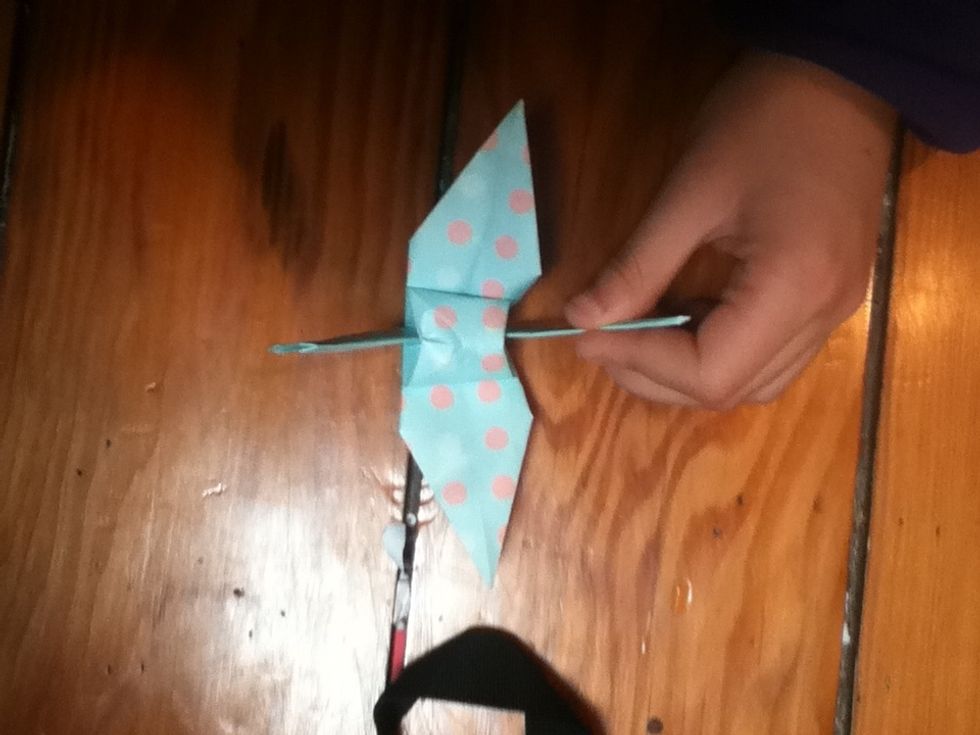 Fold the wings out and admire your beautiful work of genius! Bonus: if you fold it flat again and fold the tail and head in, it fits great inside a decorated Altoid box that I have a tutorial for!