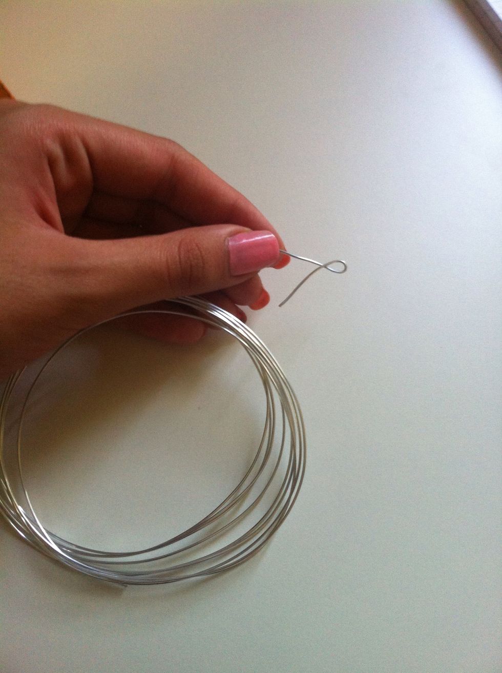 Fold the wire as shown to make the first bow loop