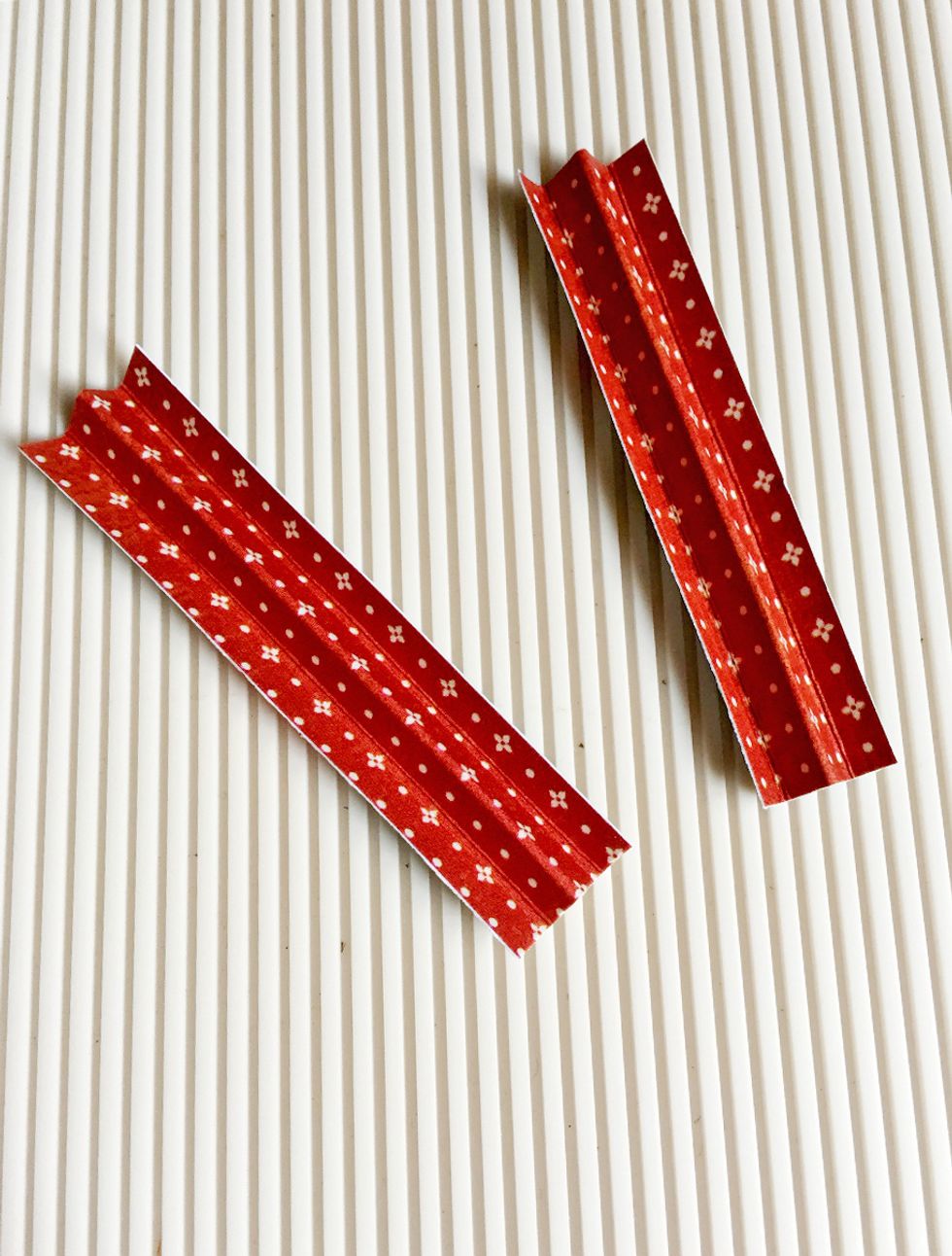 Fold them accordingly as shown... These will be side attachments for the seed pockets... The far 2 ends are the flaps that's going to be attached to the large tag...