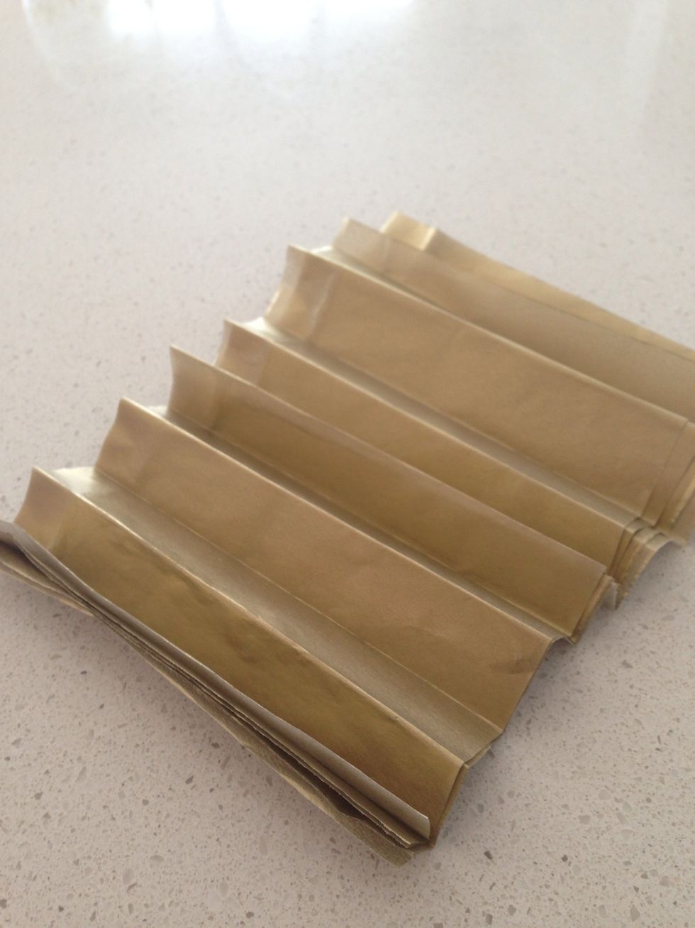 Fold them like the accordion or the fan style as above