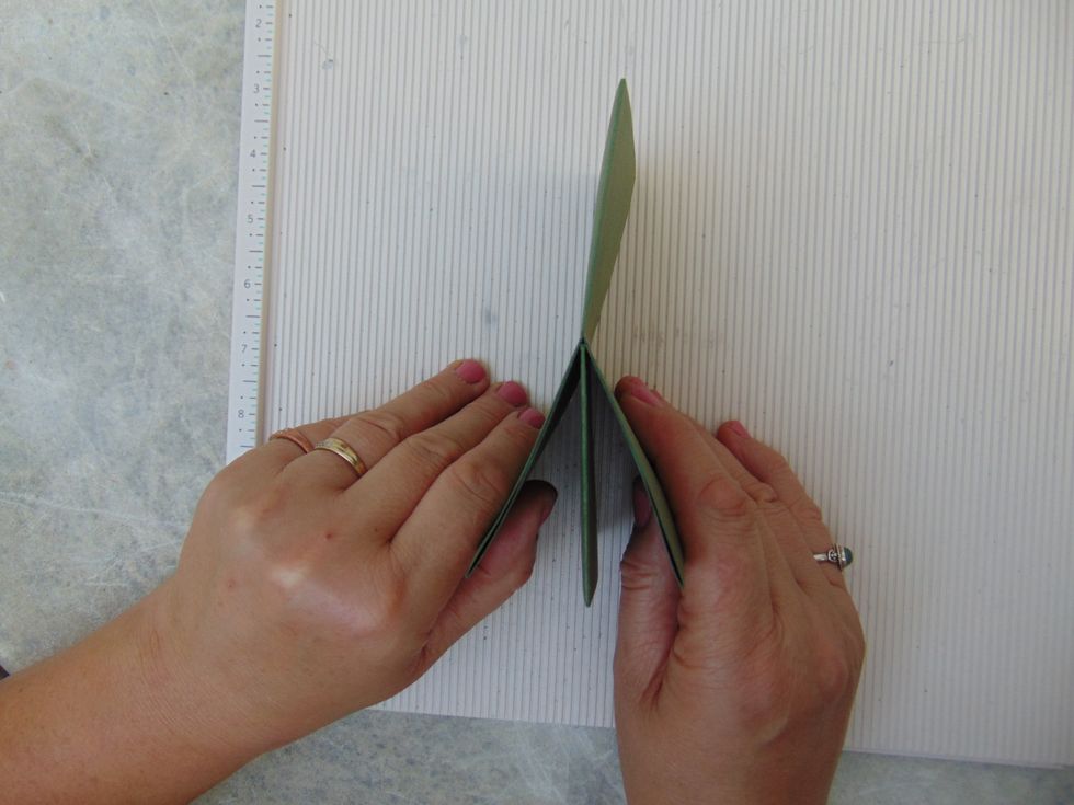 .... fold them round to meet the flap/page at the bottom and hold all three together.