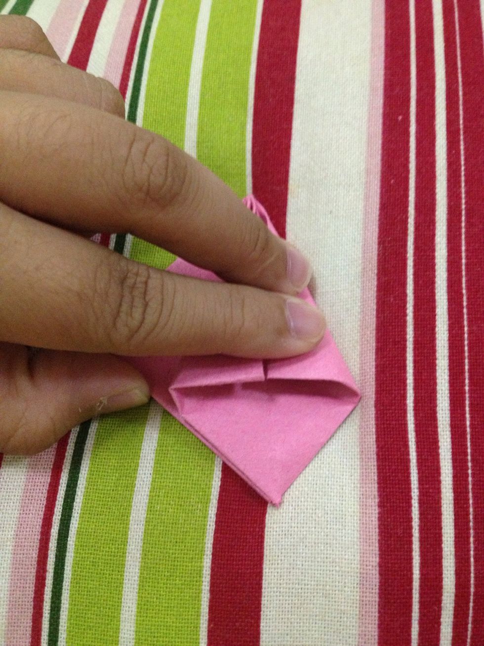 Fold these upper flaps to meet the center line.
