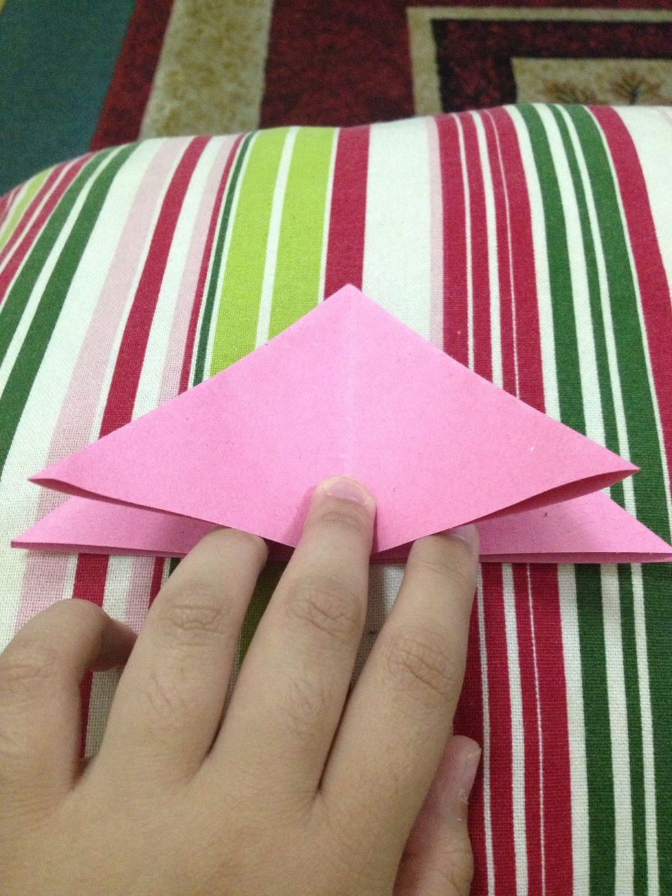 Fold these upper layers of these side corners to the center line.