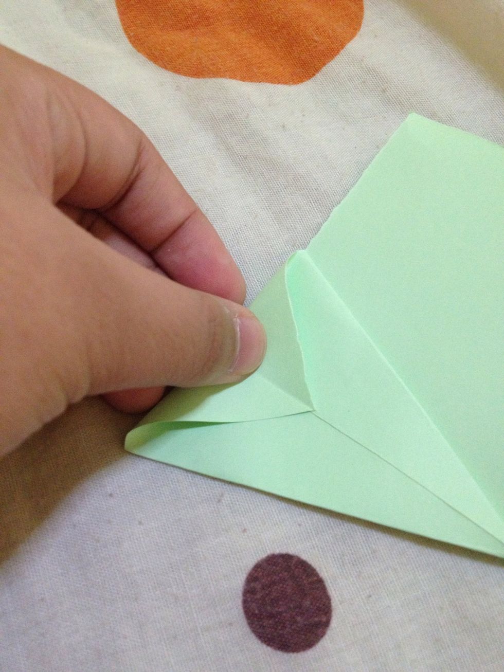 Fold this corner downward. Do the same to the other corner.