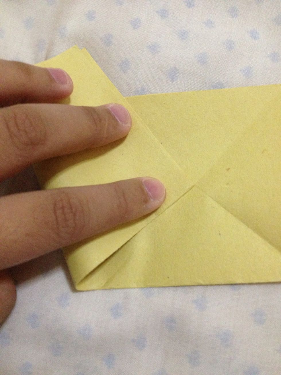 Fold this left corner to meet this center of the right part.