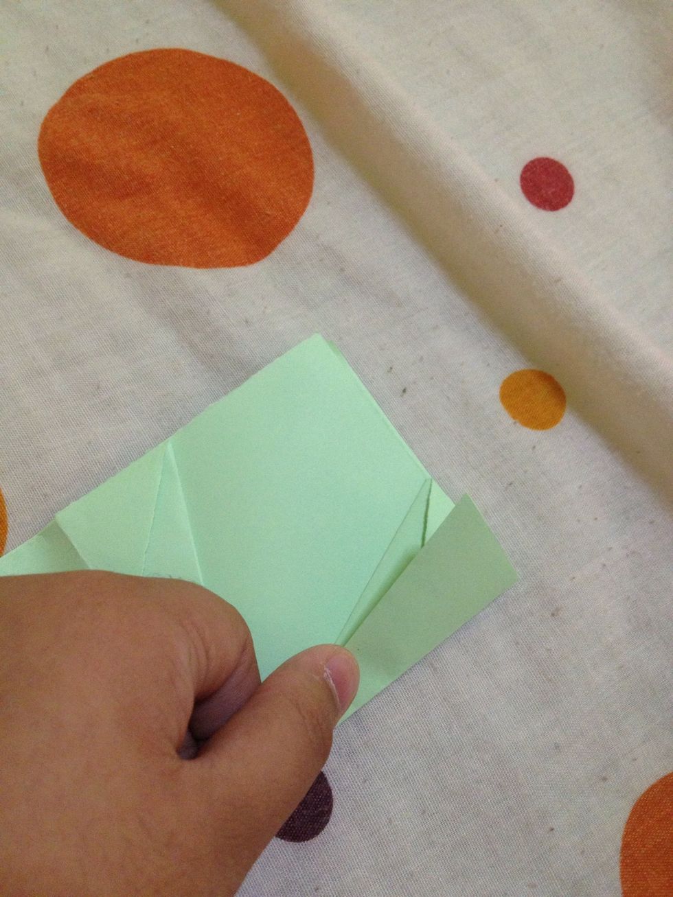 Fold this side part upward. Do the same to the other part.