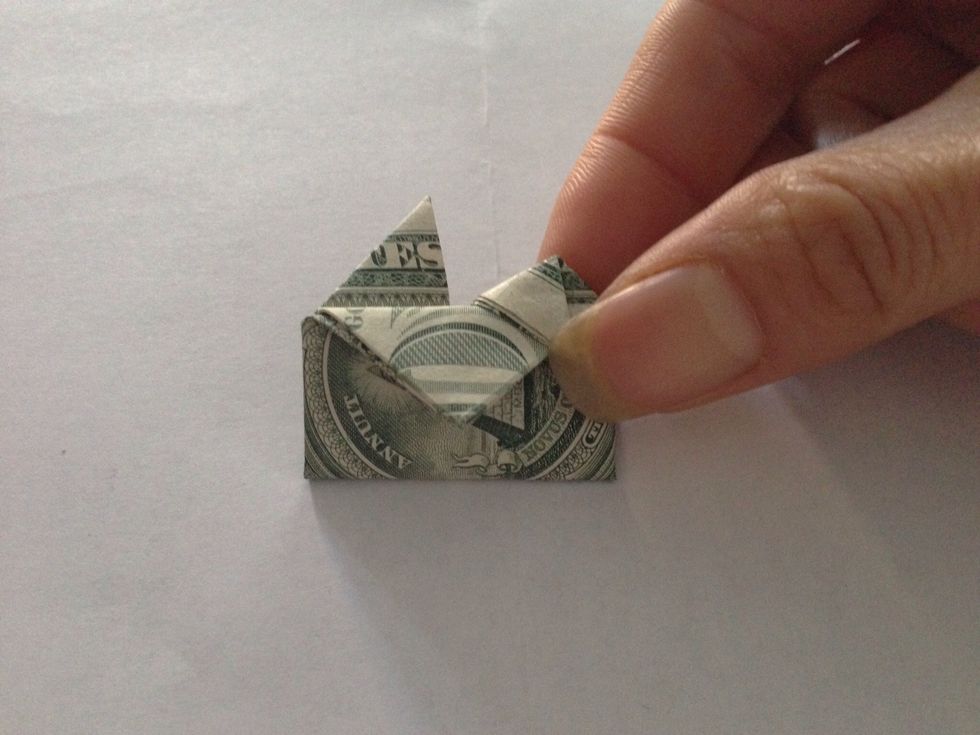 Fold tips sideways to the front to create top shape of heart.