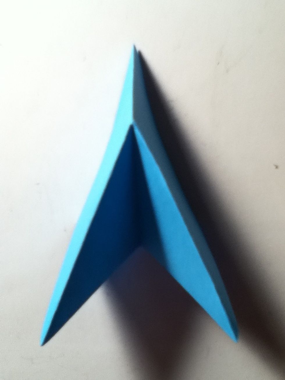 Fold to make a arrow like shape now make 7 more
