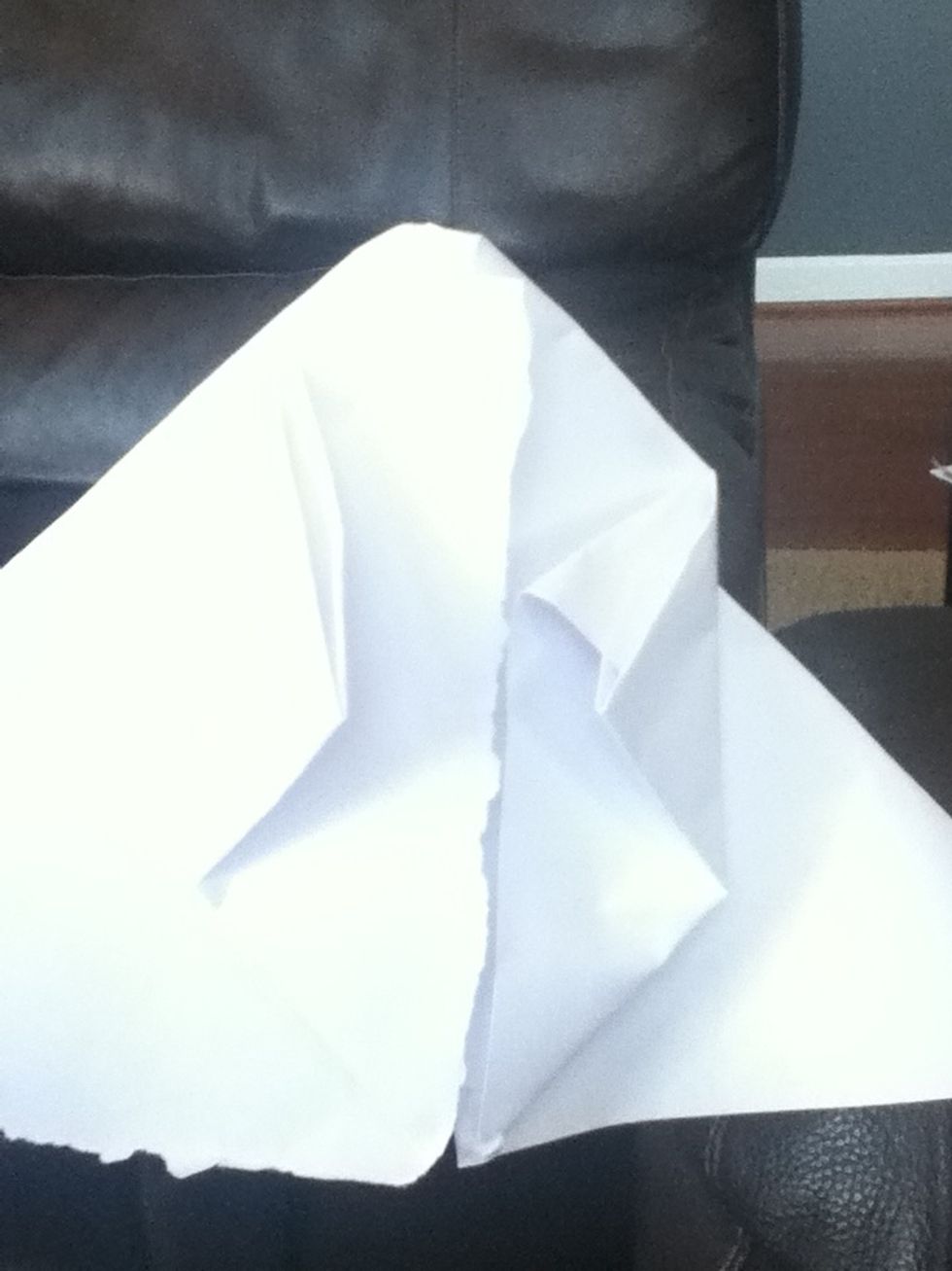 Fold top corner into the flap.