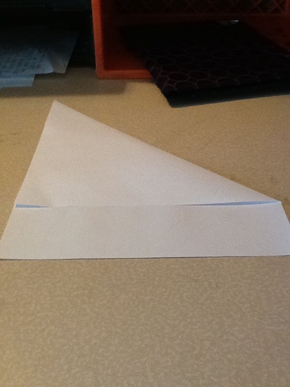 Fold top corner to side and match edges