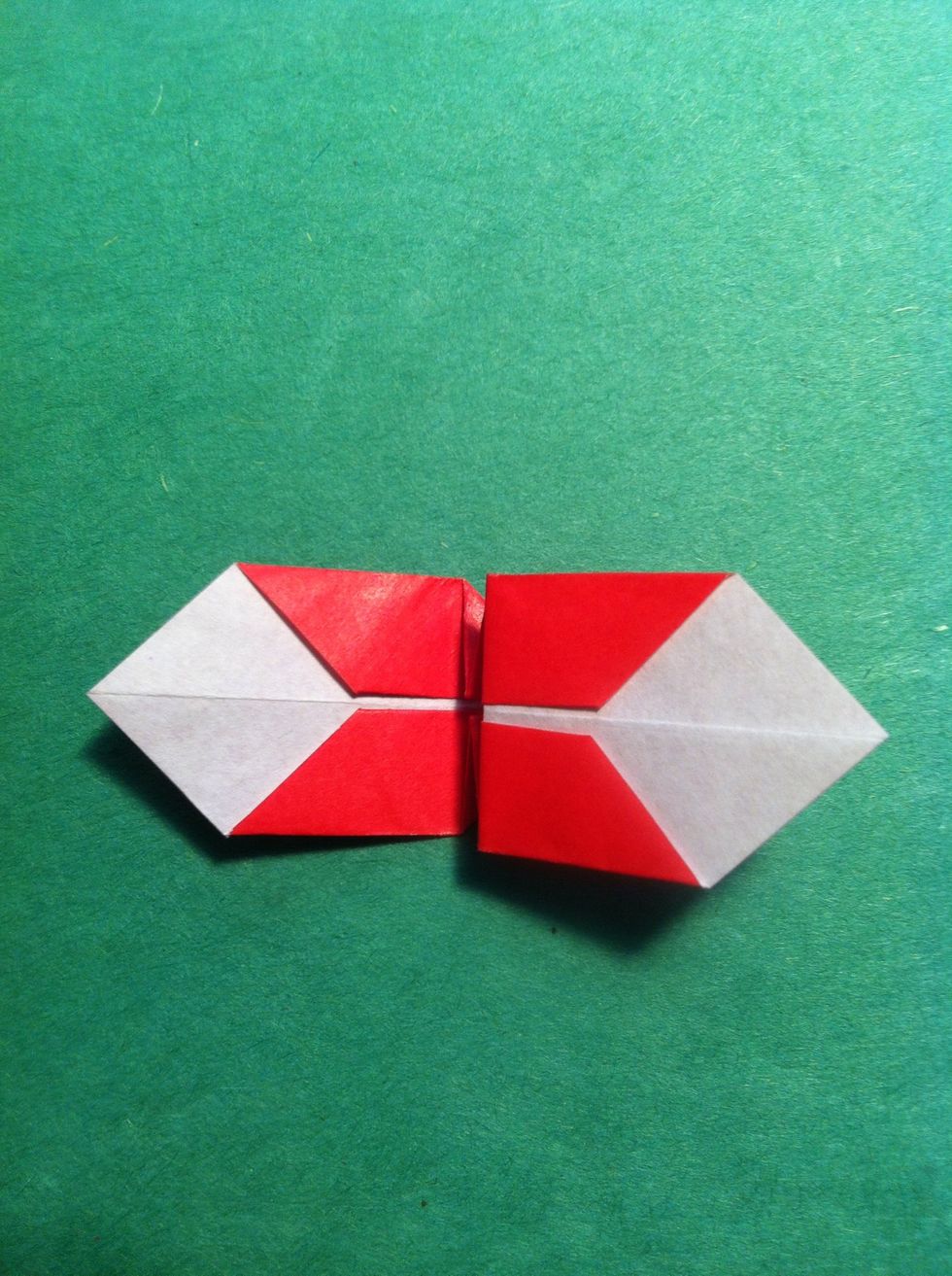 Fold top layer over to the right following that crease you just made. Repeat on the back.