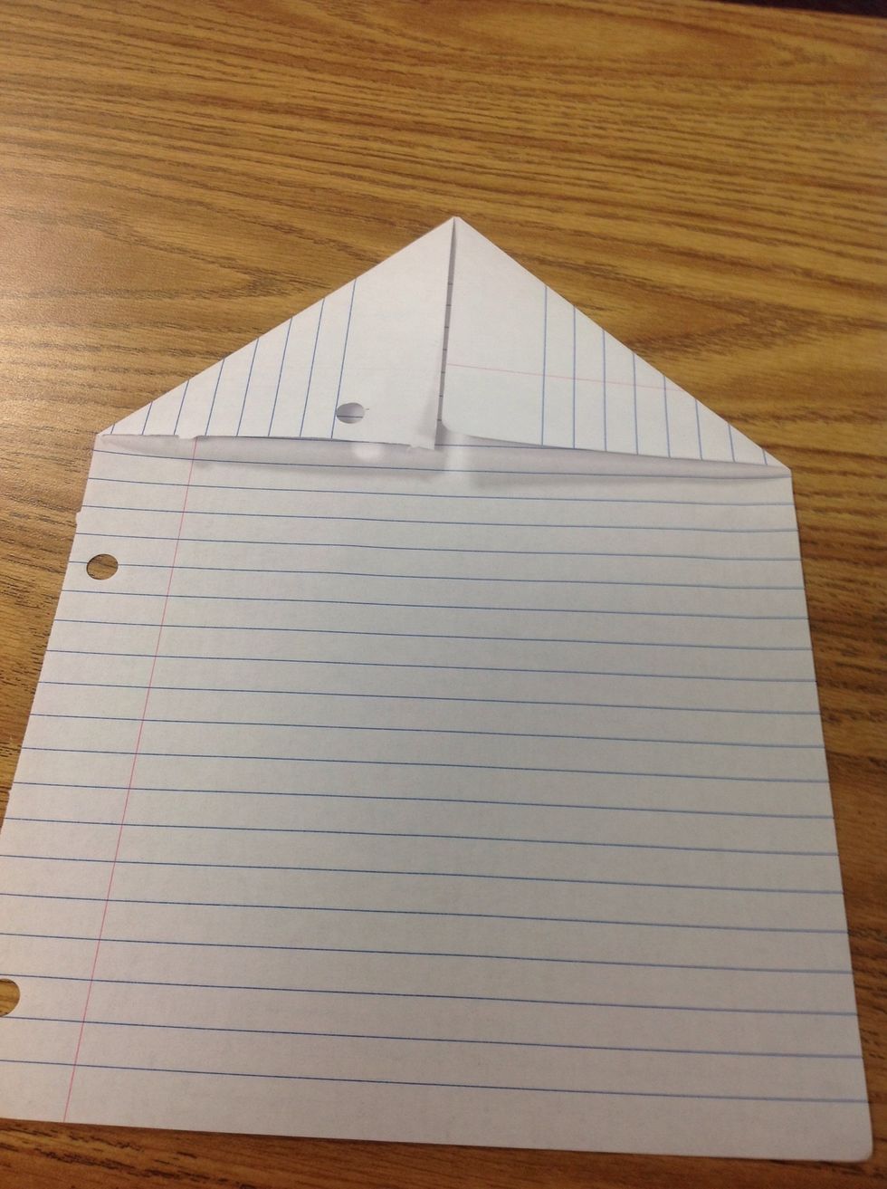 Fold top left corner to the center