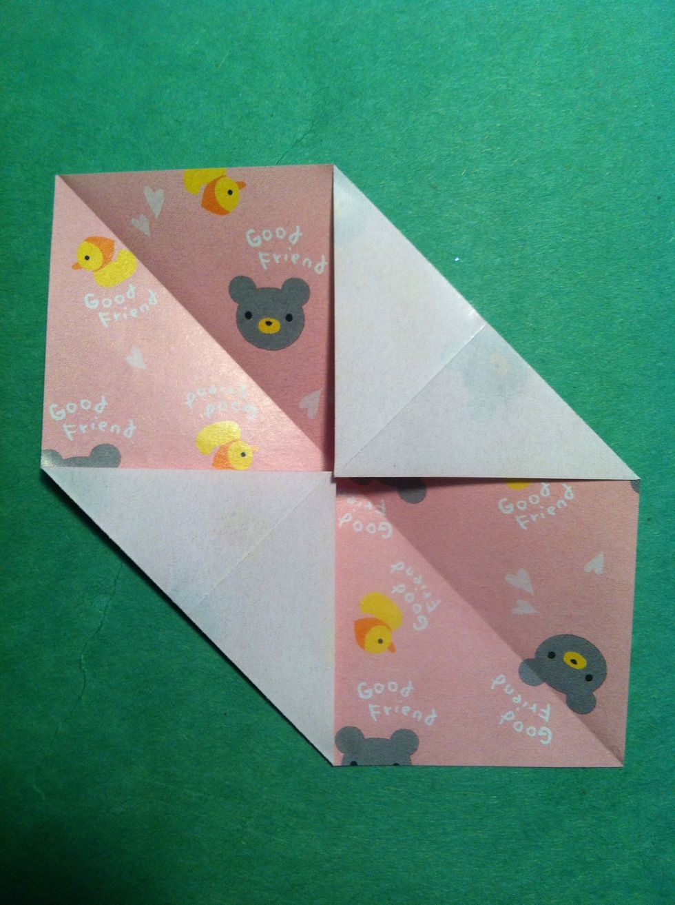 Fold top right corner& bottom left corner to center. Unfold.