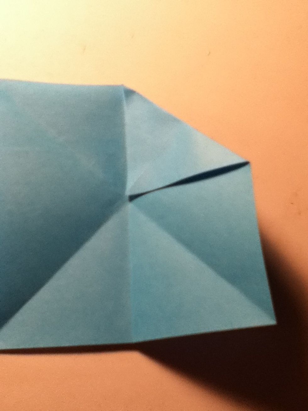 Fold top right corner into the center