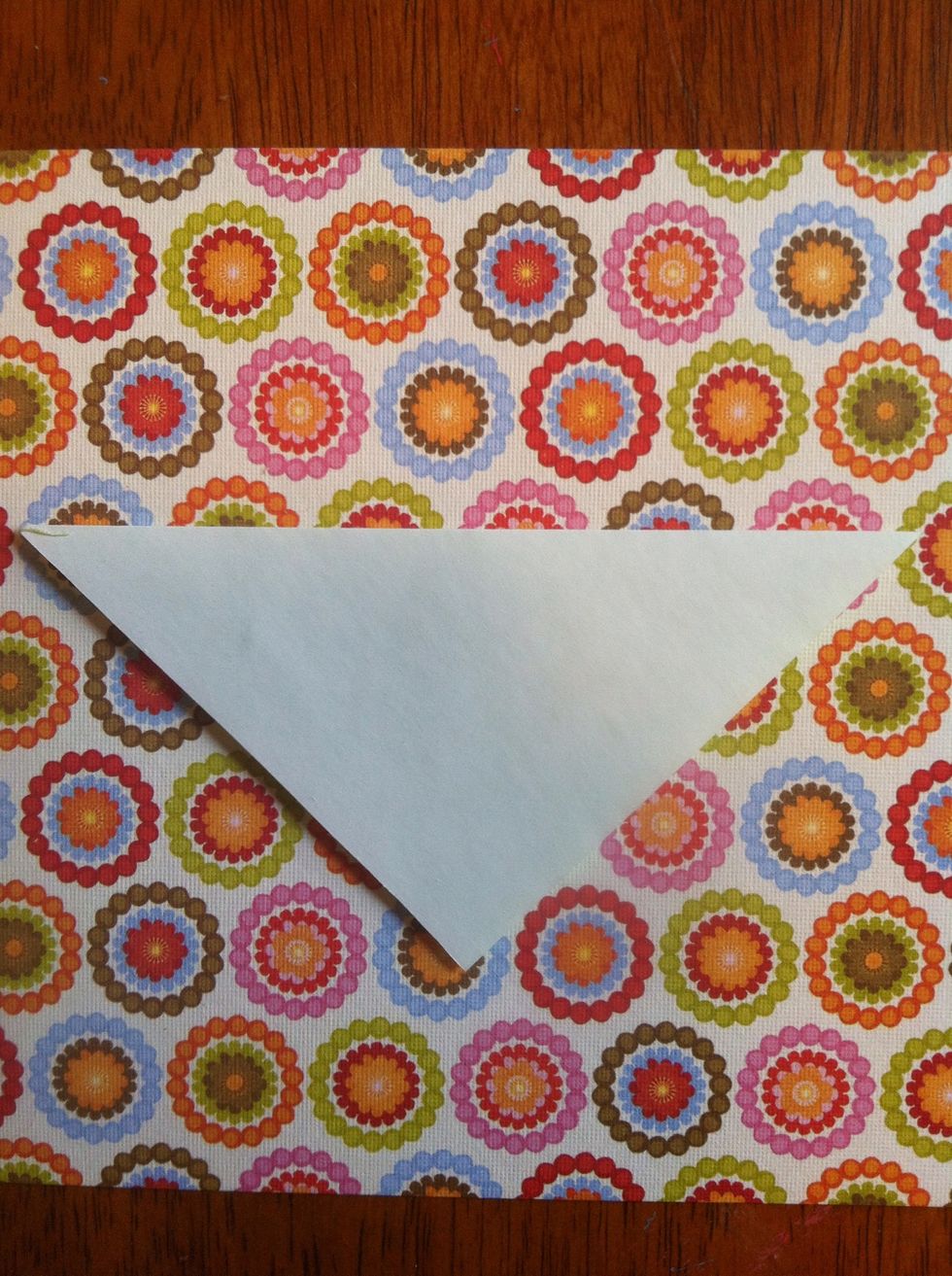 Fold top tip to bottom tip.