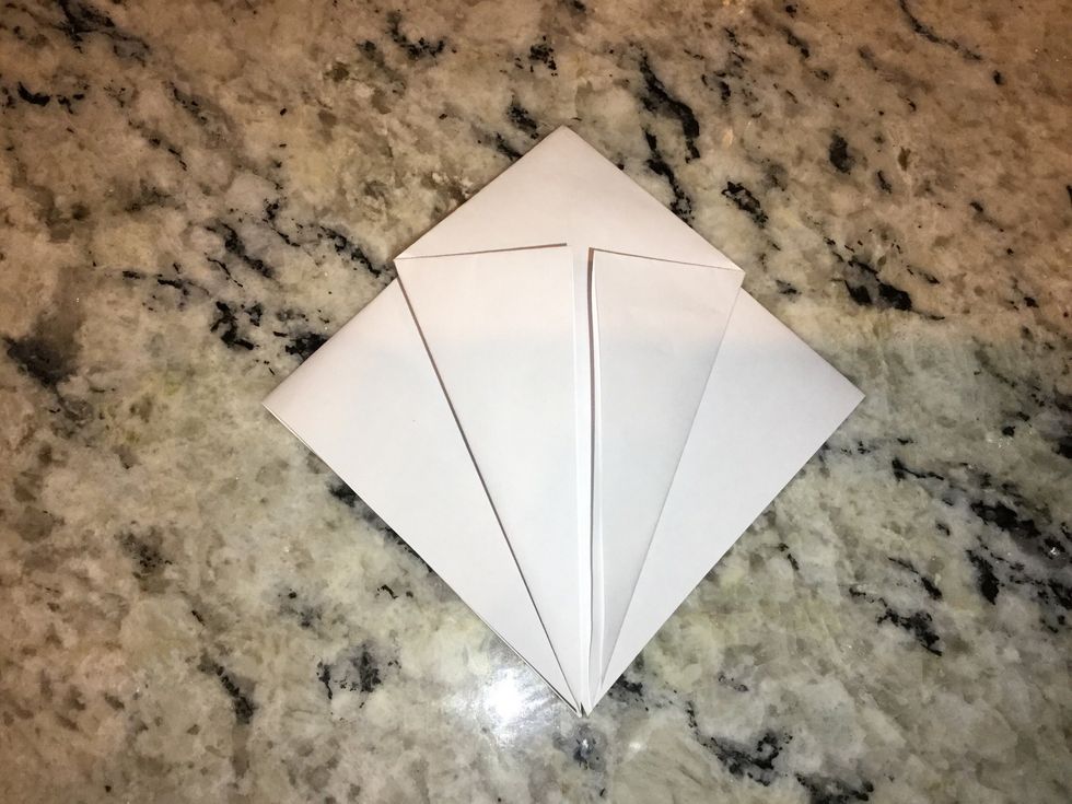 Fold triangle into the center of the square