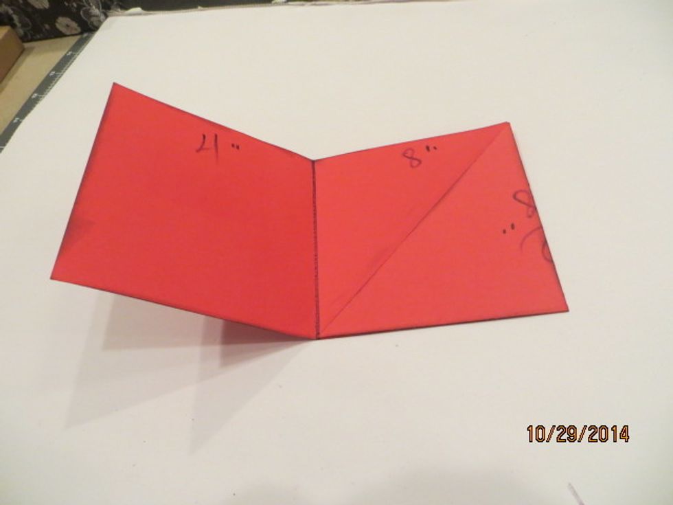 Fold Triangle to center and glue across the bottom to form pocket.