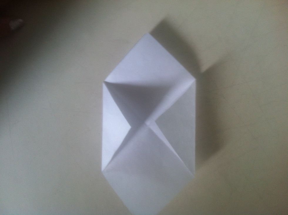 Fold two corners towards the centre