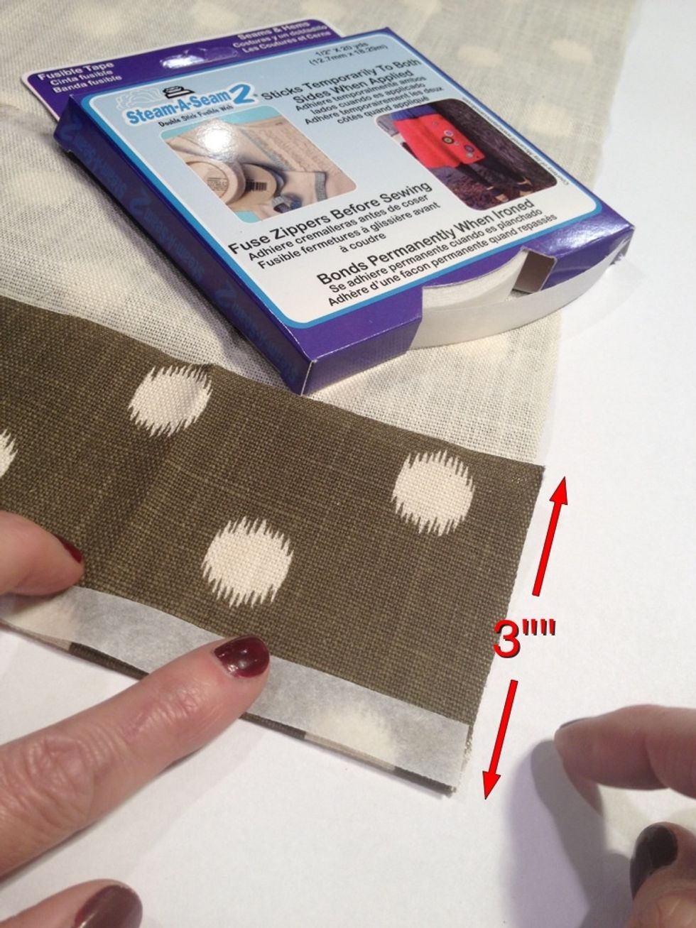 Fold up a bottom hem of 3" and press with an iron. Apply Steam-A-Seam 2 to the bottom edge of the fold and press and steam in place with an iron. Remove the paper backing from the Steam-A-Seam.