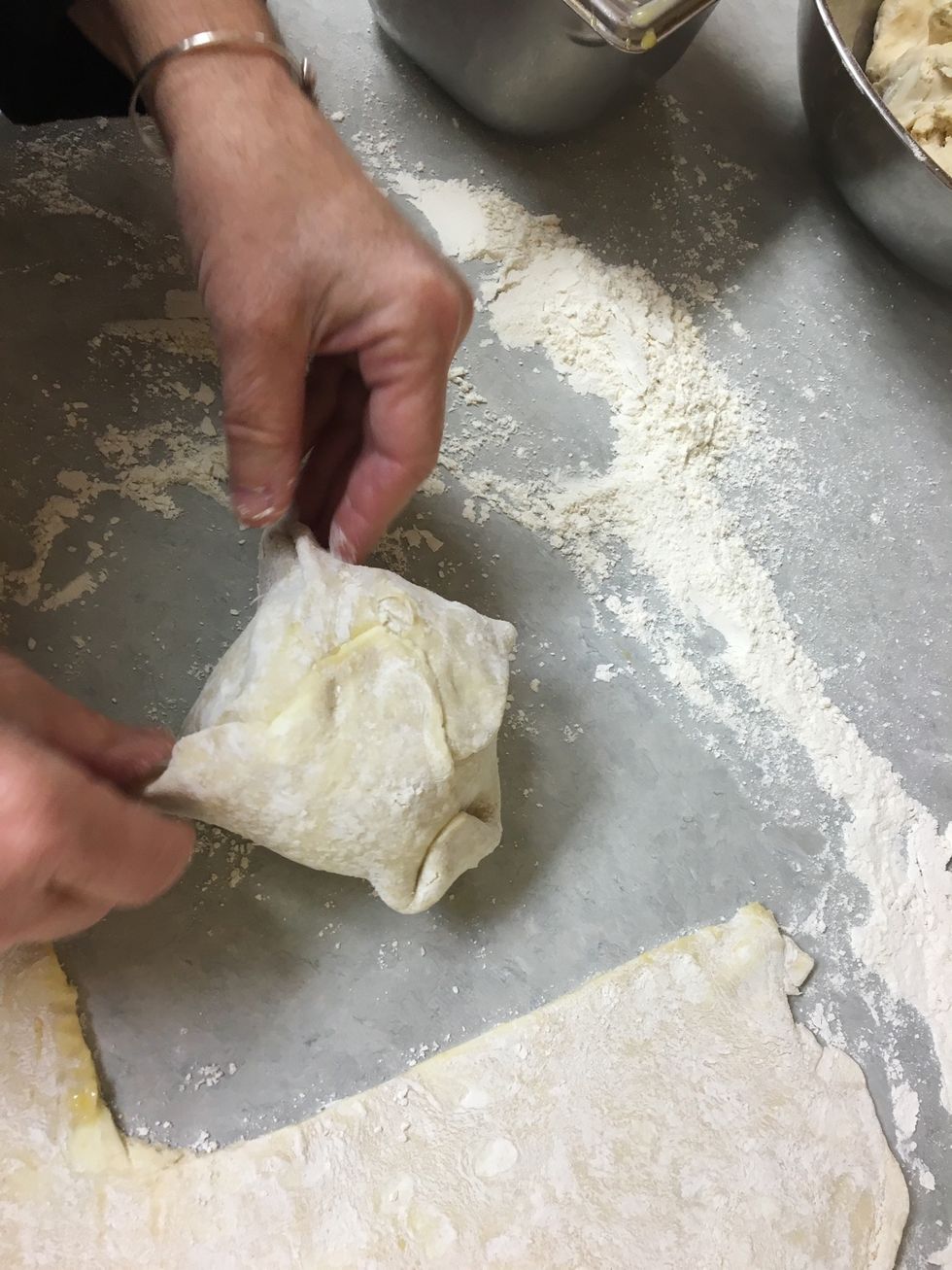 Fold up all the edges and pinch seams closed