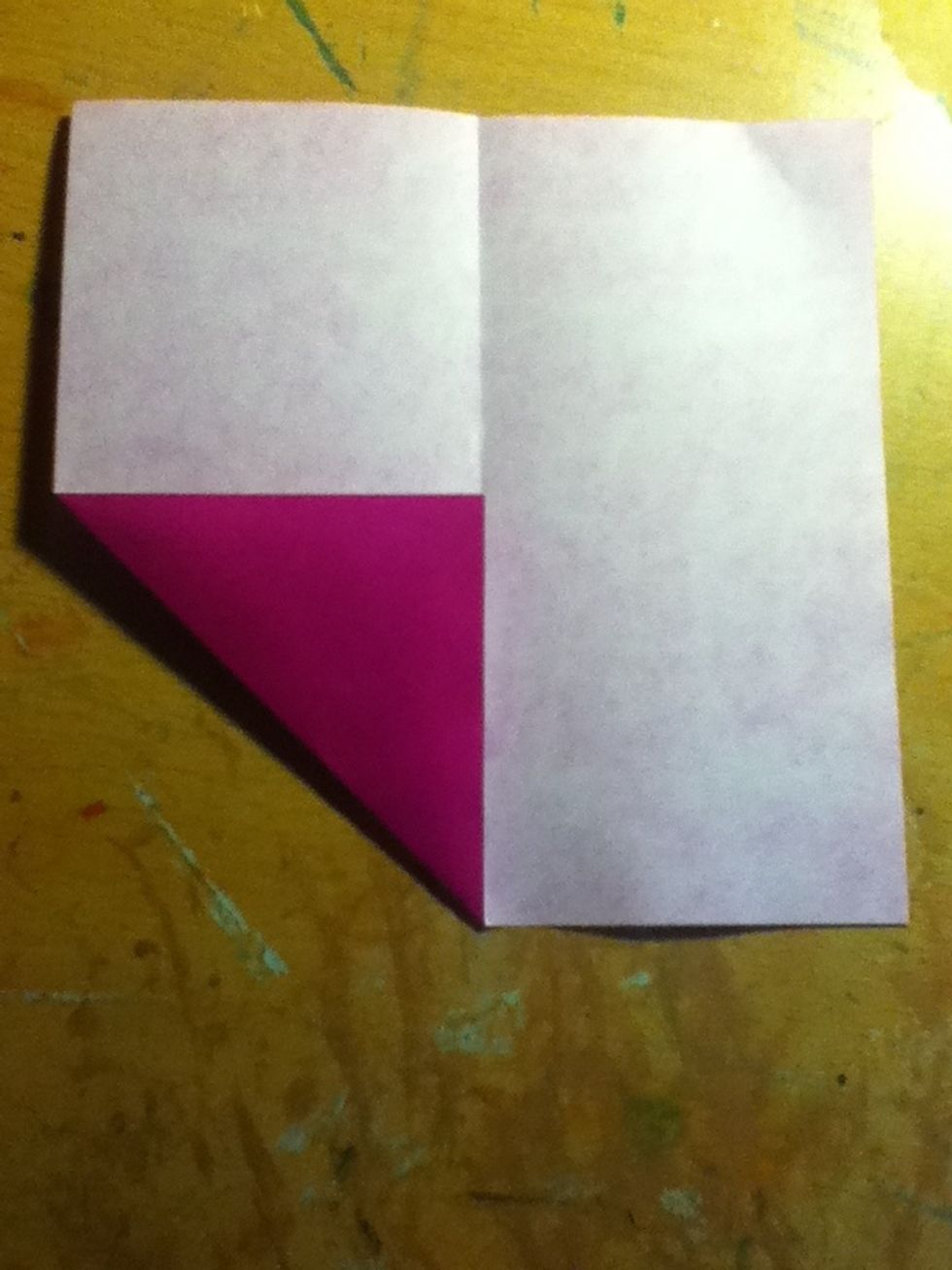 Fold up one corner and line it up as shown
